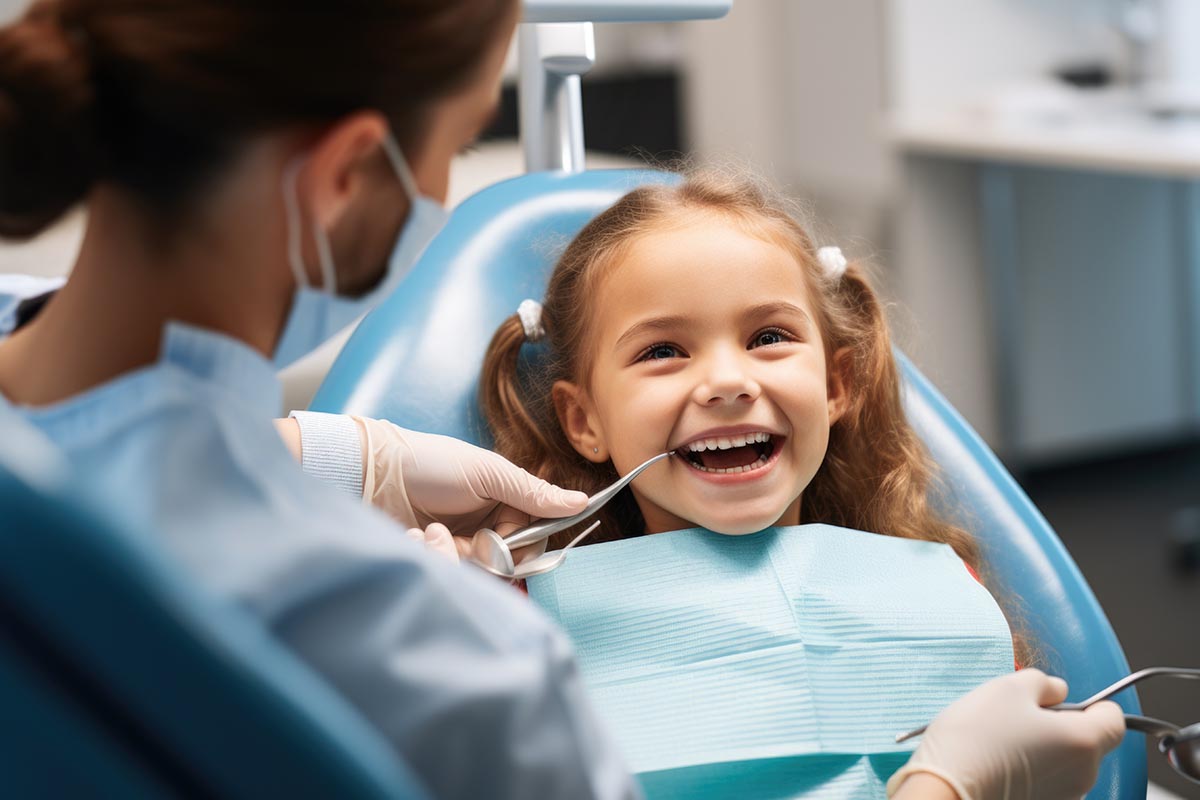 Laughing little girl sitting dentistry dental clinic